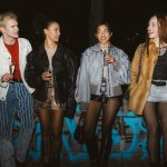 young adults showing off high and low fashion blends